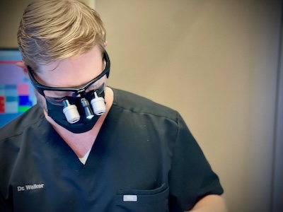 Longview dentist examining an patients teeth