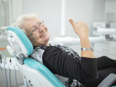 woman in exam chair discussing treatment