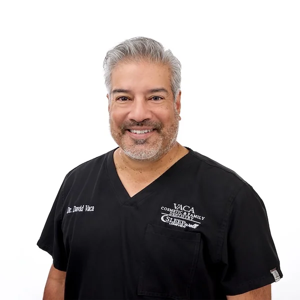 Dr. Vaca and Dr. Vaca pose for a photo together at their practice