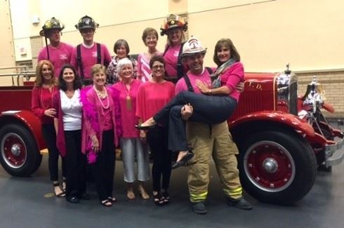 Firemen posing with the Vaca Cosmetic & Family Dentistry group